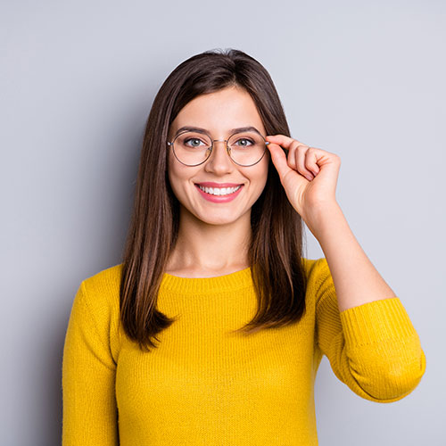 Young adult woman wearing round frame eyeglasses