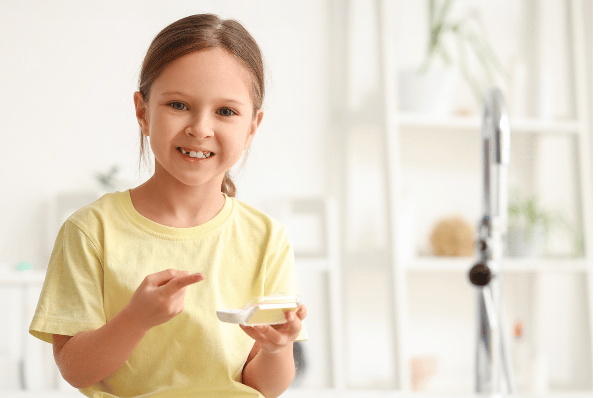 a young girl with contact lenses in the bathroom