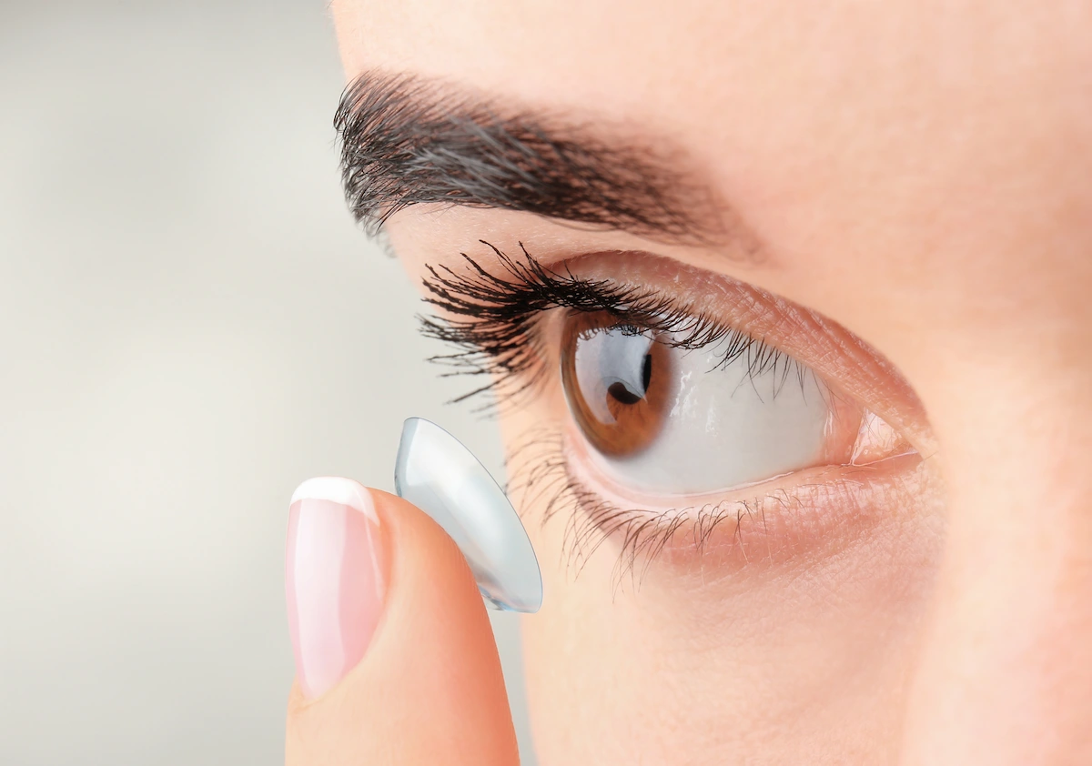 Personal placing contact lens on eye